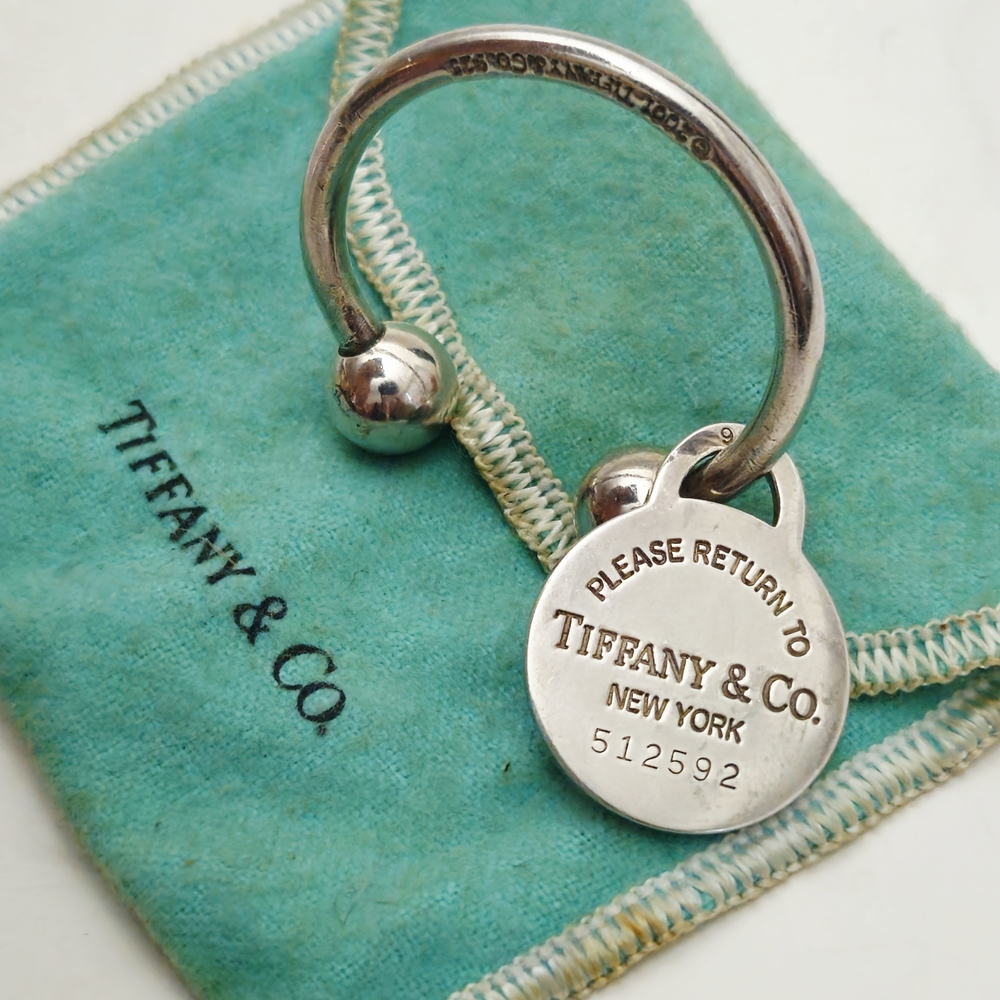 Please Return To Tiffany & Co. silver key ring with screwball closure
